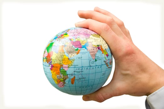Hand holdings a globe on a whiteness