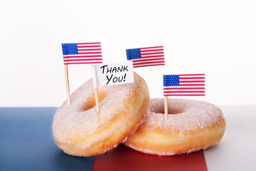 Four Donuts with American Flags and a Thank You Flag