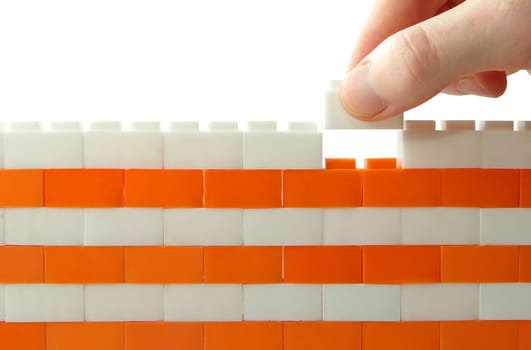 compleeting the wall on a white background