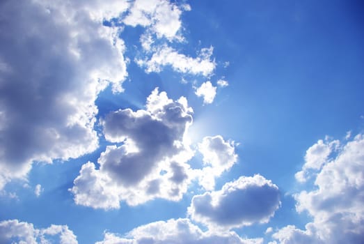 sun in a blue cloudy sky