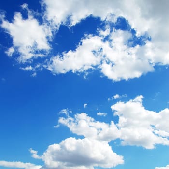Blue sky background with tiny clouds