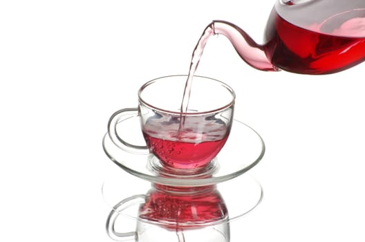 Tea being poured into glass tea cup