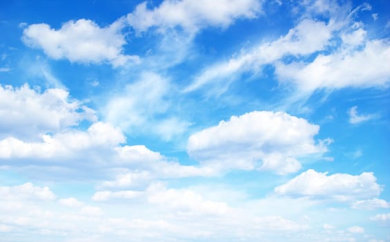 Blue sky background with tiny clouds