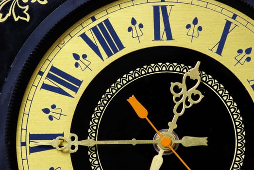 Old clock close-up with roman numbers