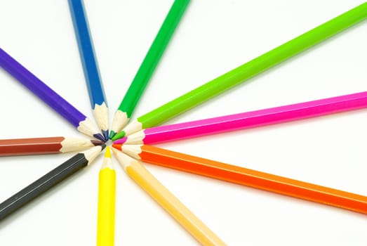 Assortment of coloured pencils  on white background