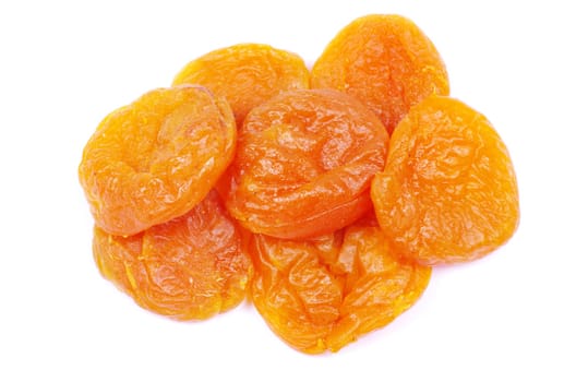 heap of dried apricots over white