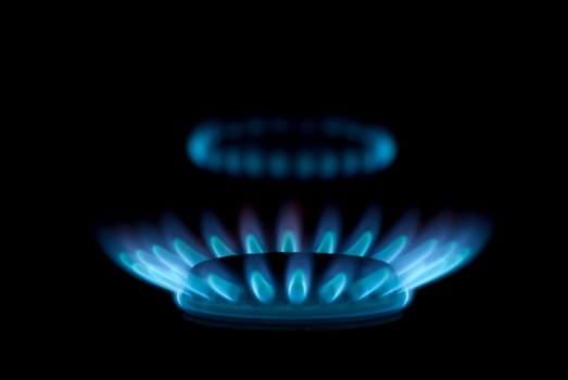 flames of gas stove in the dark