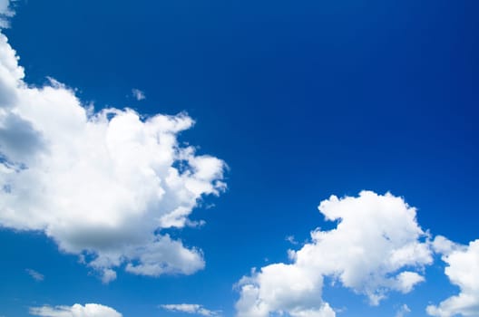 blue sky background with tiny clouds