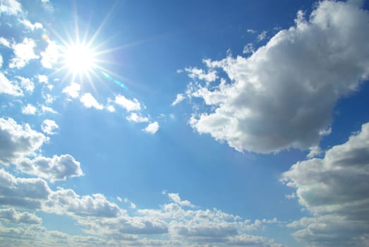 Blue sky background with a tiny clouds