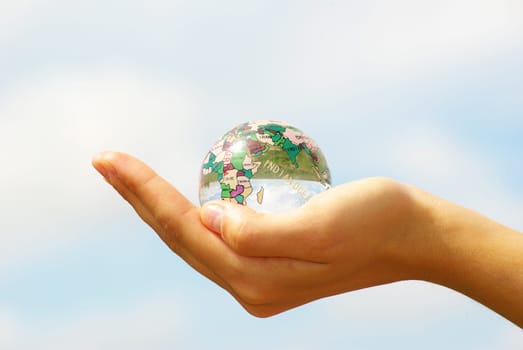globe on the human hand