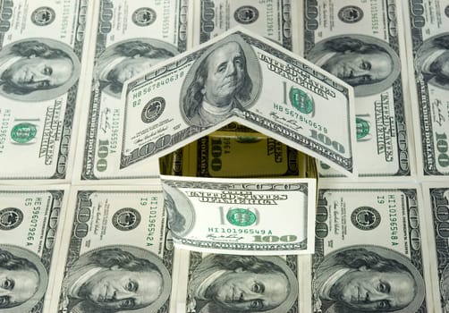 Money house on dollars background
