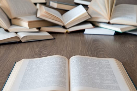 books on wooden deck tabletop