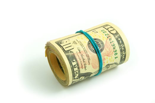 Roll of dollars close-up against white background.