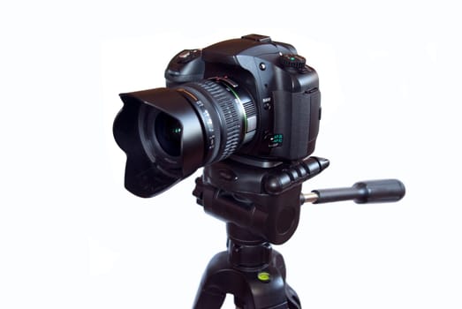 Digital photo camera  on a  tripod