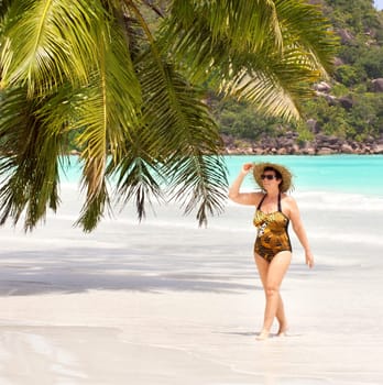 Woman enjoys beach holiday