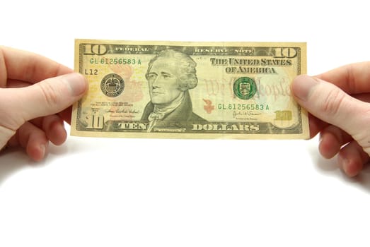 Hands hold 10 bill on white background