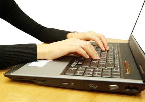 hands fast typing on laptop