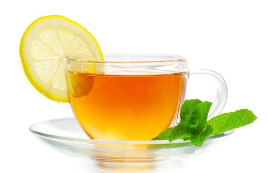 tea in cup with leaf mint and lemon isolated on white background