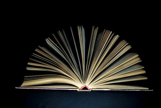 open book on black background