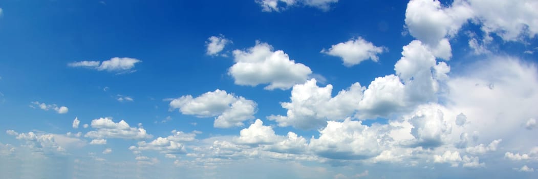 blue sky background with tiny clouds