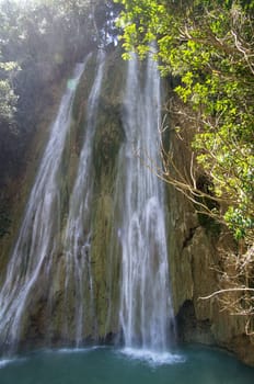 waterfall in deep green forest