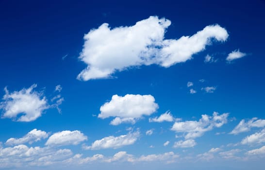 blue sky background with tiny clouds