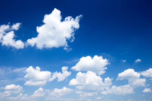 Blue sky background with a tiny clouds