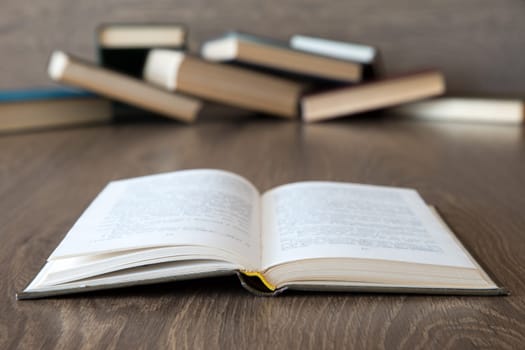 books on wooden deck tabletop