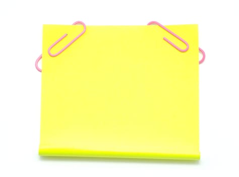 Blank note paper and red paper-clip isolated  on white