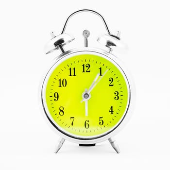 Alarm clock on white background. Showing time five minutes past six