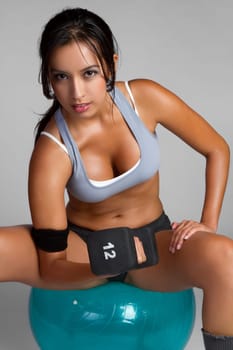 Healthy latin exercising fitness woman
