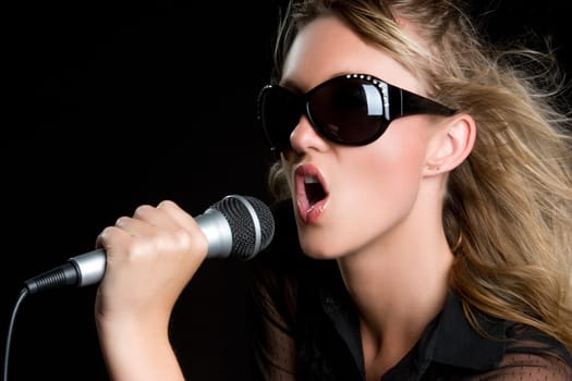 Beautiful young microphone singing woman