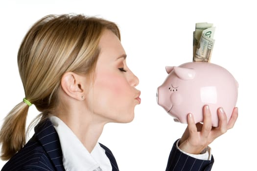 Blond woman kissing piggy bank
