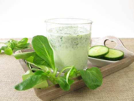 Green smoothie with field salad and cucumber