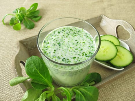 Green smoothie with field salad and cucumber