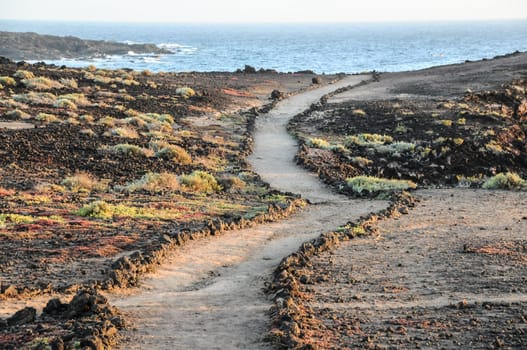 Travel Concept Background - Pathway in the Volcanic Desert Tenerife Canaty Islands Spain