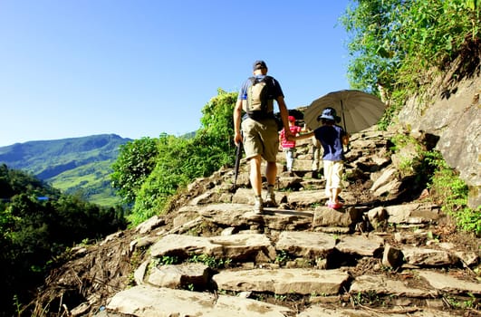 Trekkers in the Himalayan mountains, Annapurna conservation region, Nepal