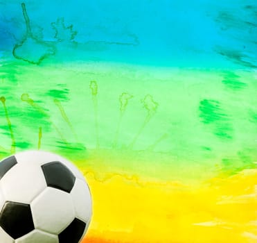 Photo of soccer ball and the colors of the Brazil flag