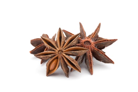Anise stars on a white background