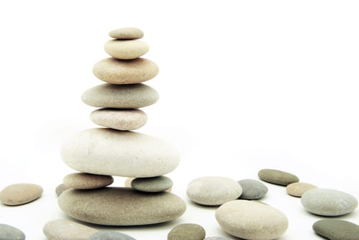 Stack of balanced stones on a white background
