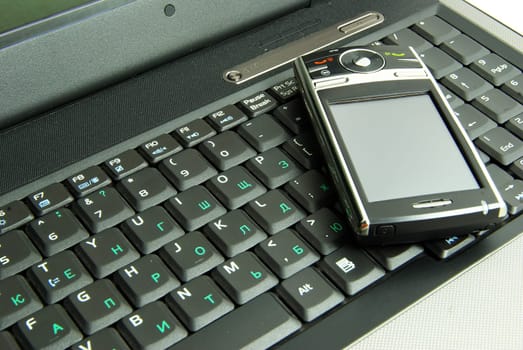 mobile isolated on a laptop