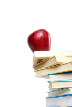 Red apple and stack of books