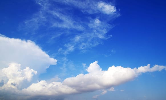blue sky background with tiny clouds