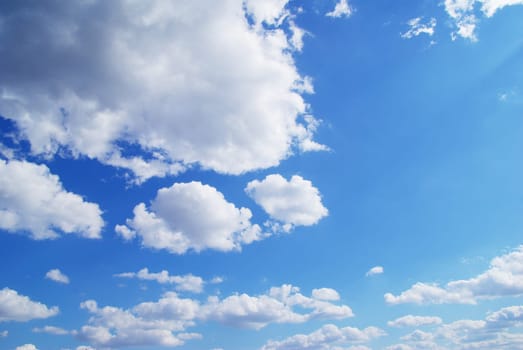 Blue sky background with a tiny clouds