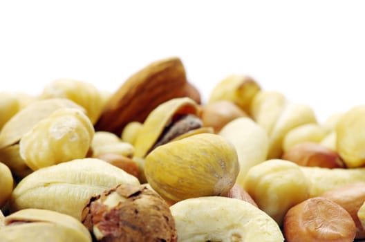 Assorted mixed nuts on white background
