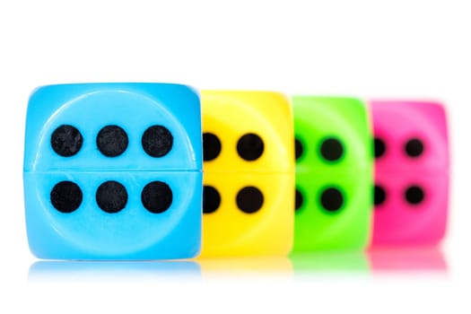 Colorful dice aligned, isolated on white background