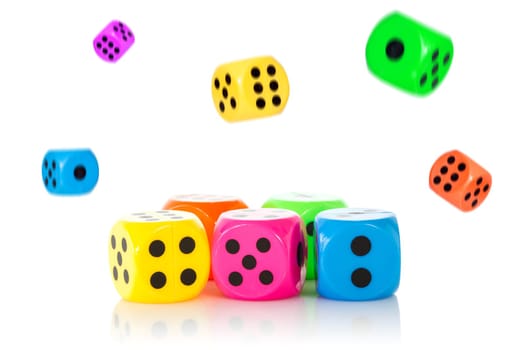Pile of falling dices with the front ones in focus. Isolated on white background