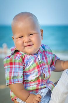 Cute baby on the tropical beach
