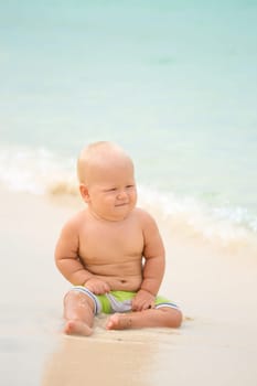 Cute baby on the tropical beach
