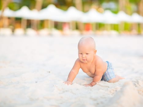 Cute baby on the tropical beach